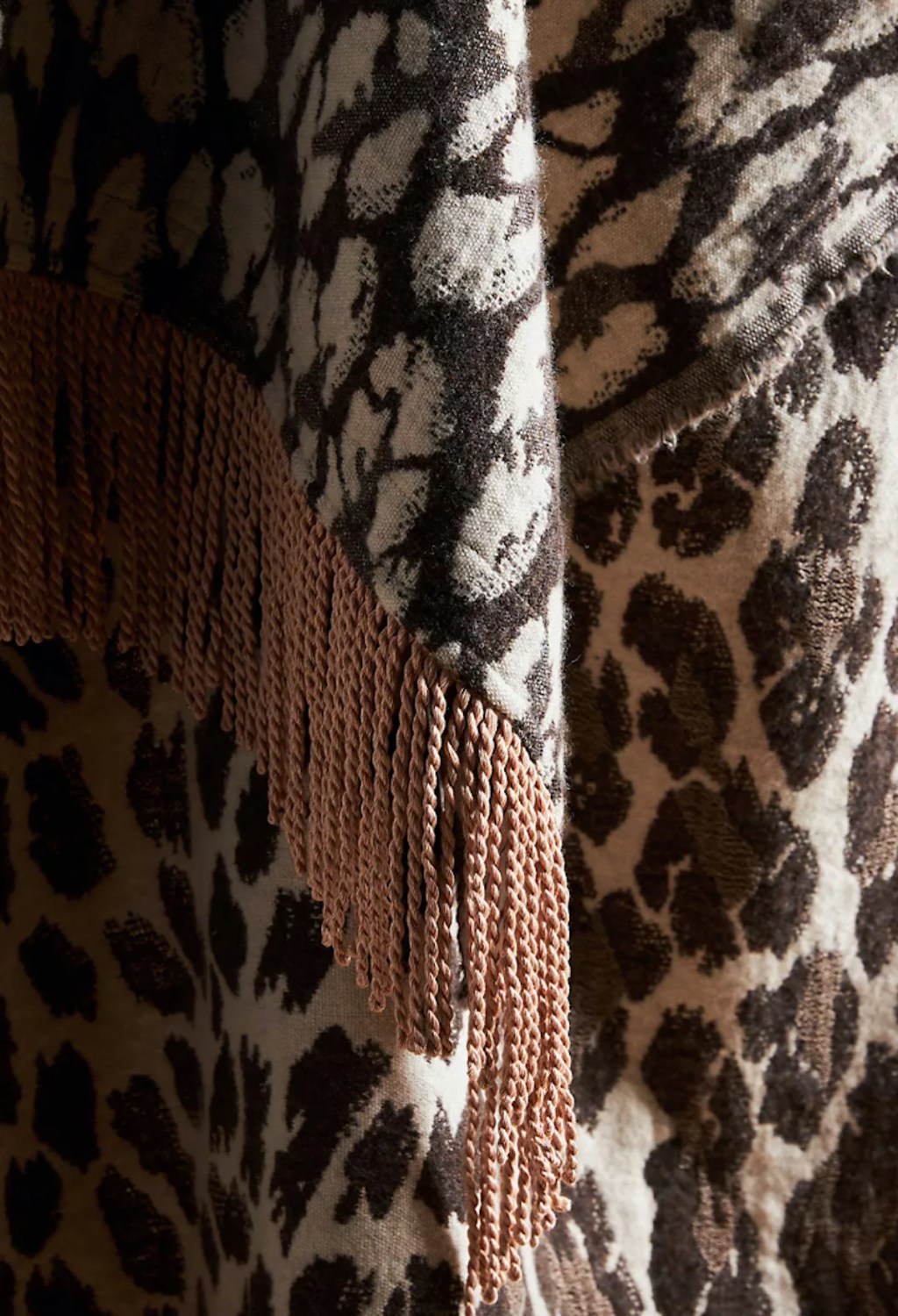 close up of dark brown leopard anthropologie blanket