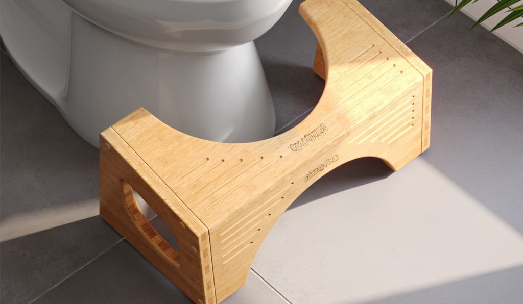 bamboo squatty potty next to the toilet