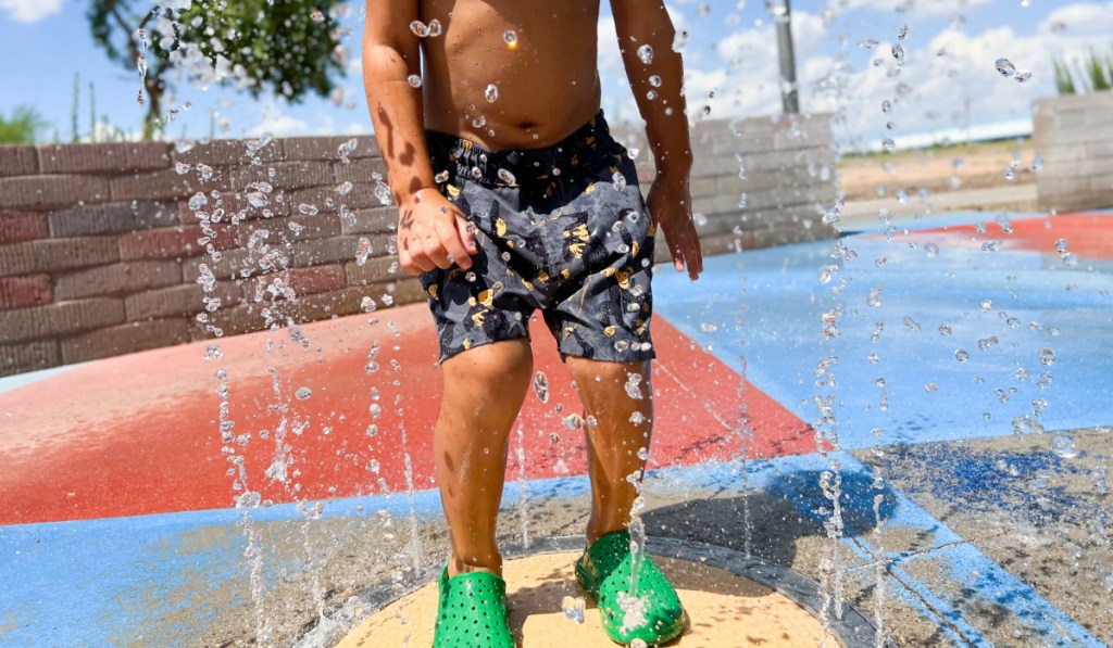 kid playing in water