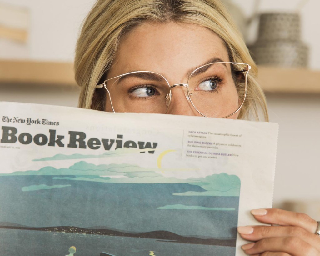 woman reading newspaper