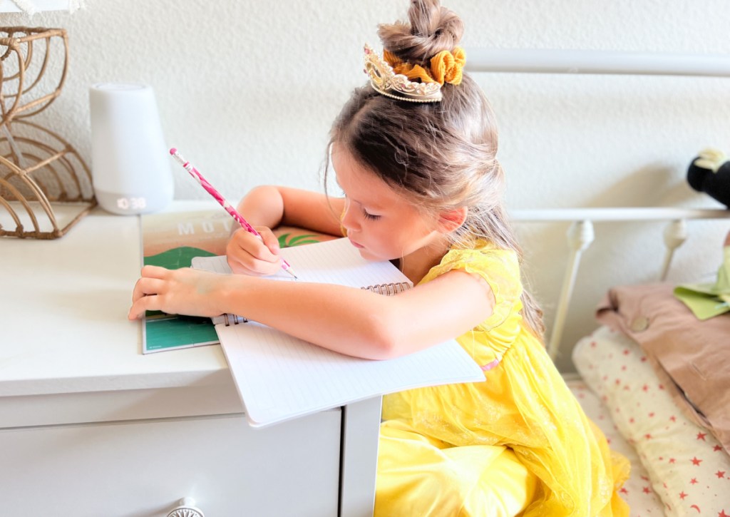 girl writing in notebook