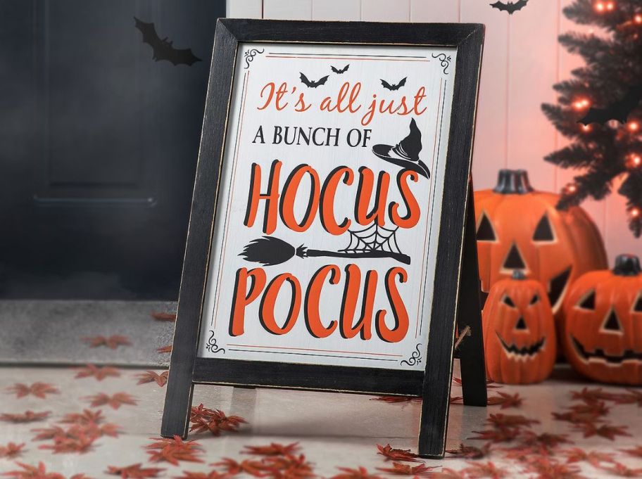 an easel porch sign that reads it all just a buncha hocu pocus