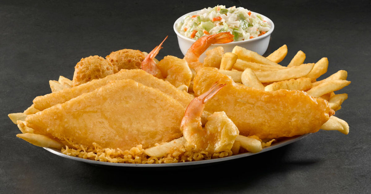 long john silvers platter of food with fries, chicken, coleslaw and hushpuppies