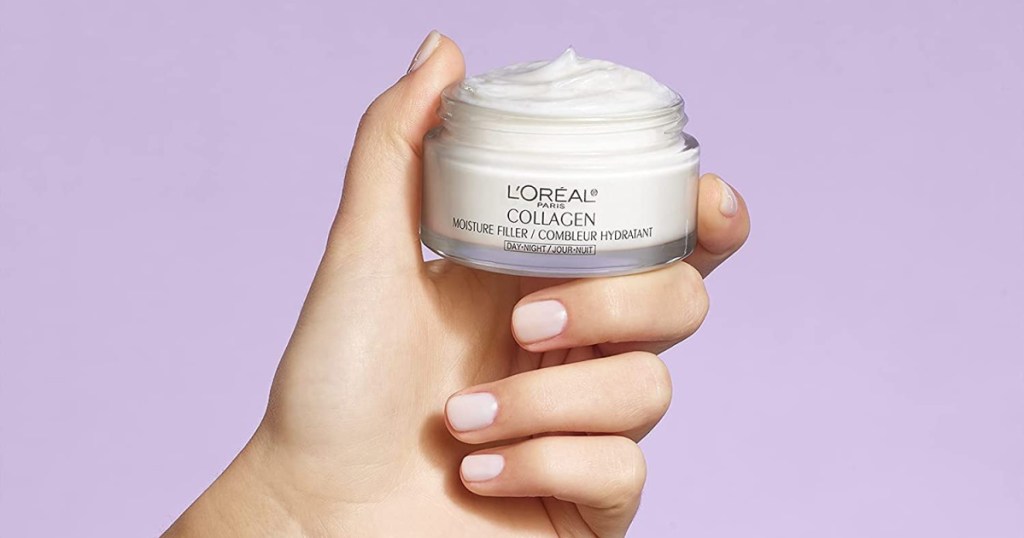 hand holding loreal paris collagen moisture filler jar