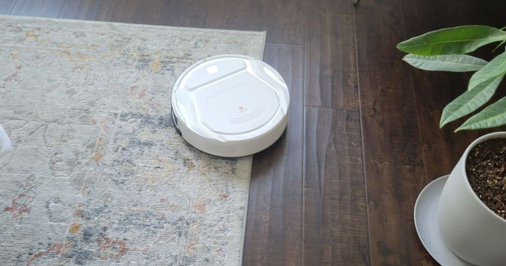 Lefant Robot Vacuum Cleaner on rug and hardwood floor