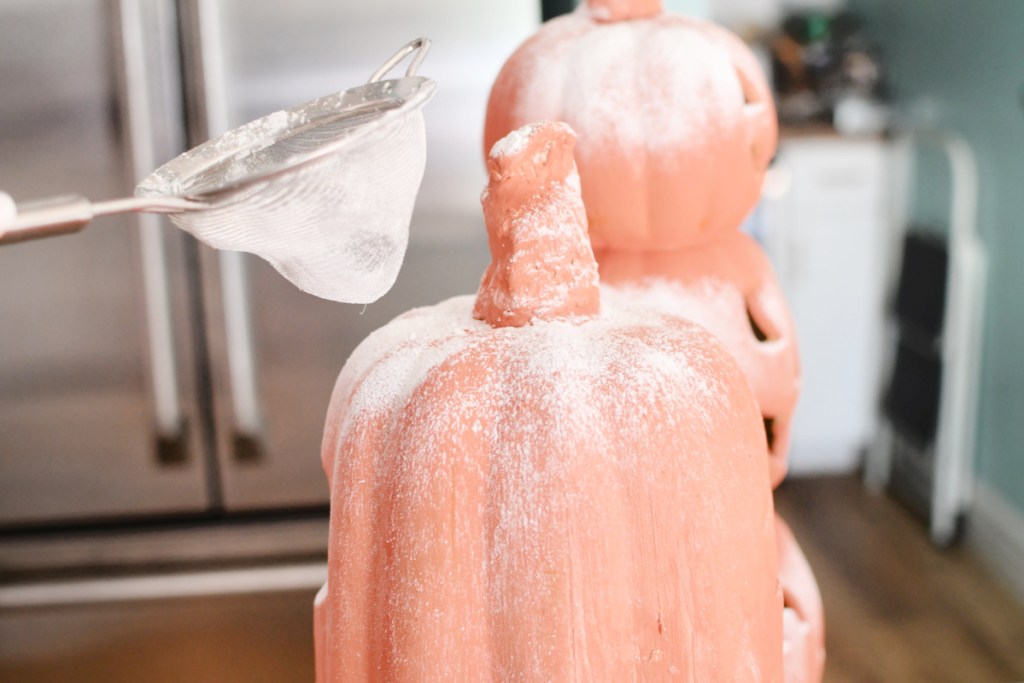 sprinkling starch on pumpkins