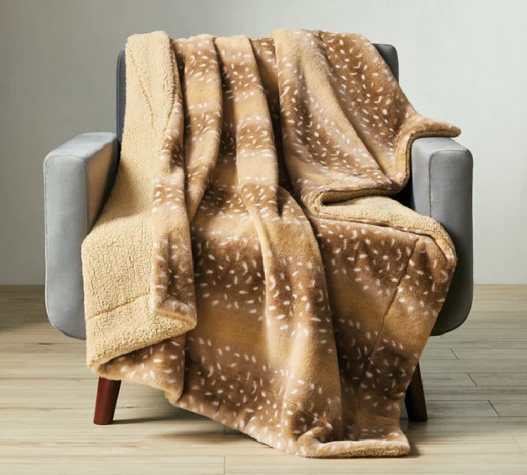 deer patterned faux fur throw blanket on gray chair