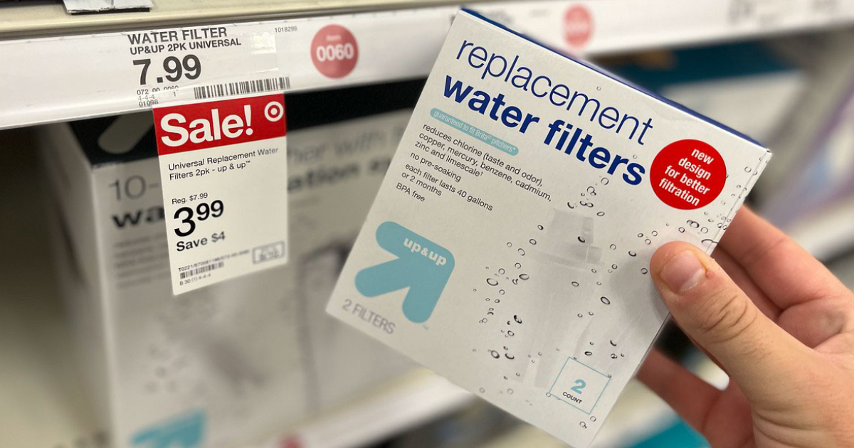 hand pulling a target up and up water filter pack off a store shelf