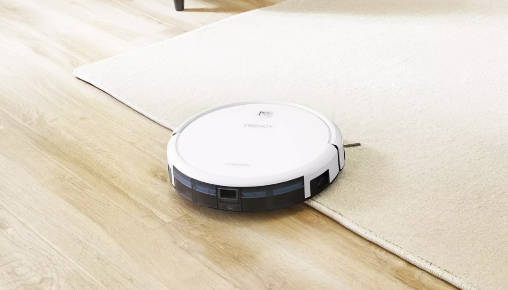 white robot vacuum on rug