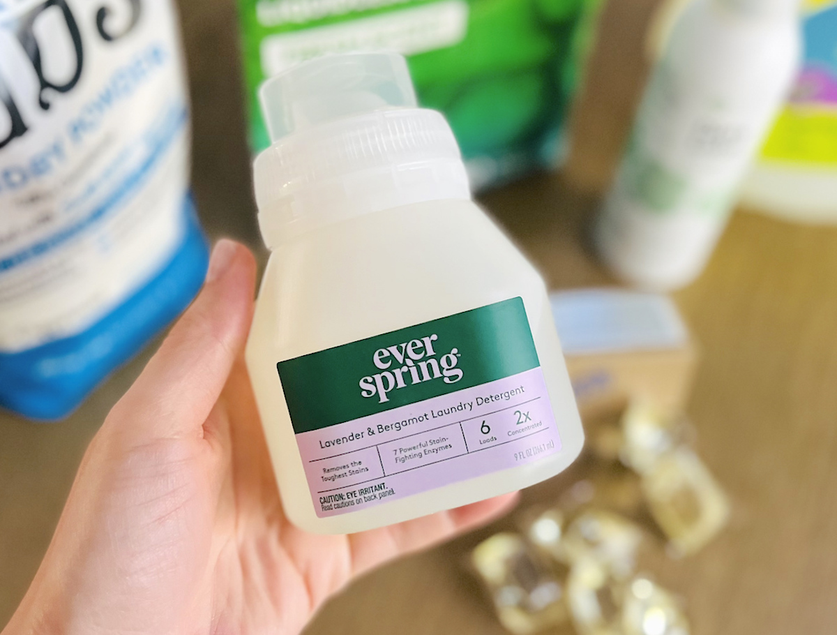 hand holding everspring liquid laundry detergent travel size bottle