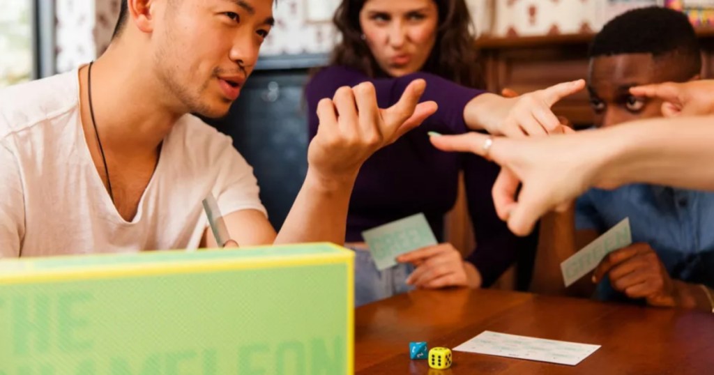 Family playing the Chameleon game at table