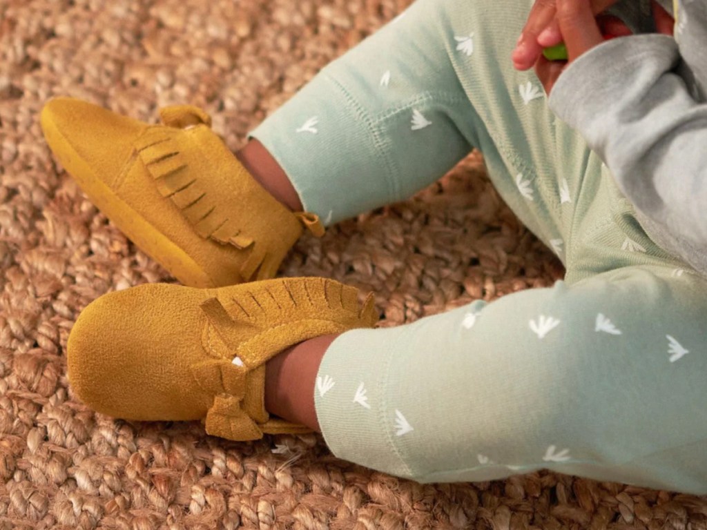 little toddler wearing brown Gerber Suede Shoes