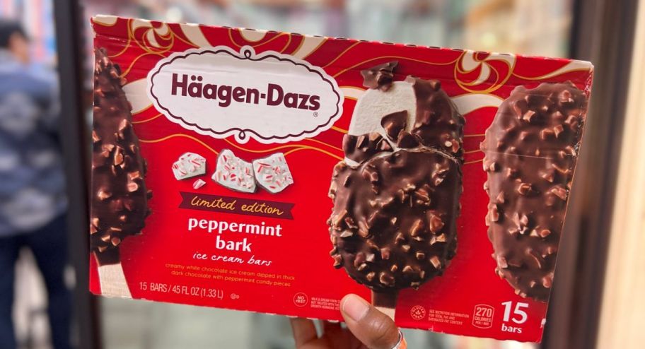 Haagen-Dazs Peppermint Bark Ice Cream Bars in womans hand