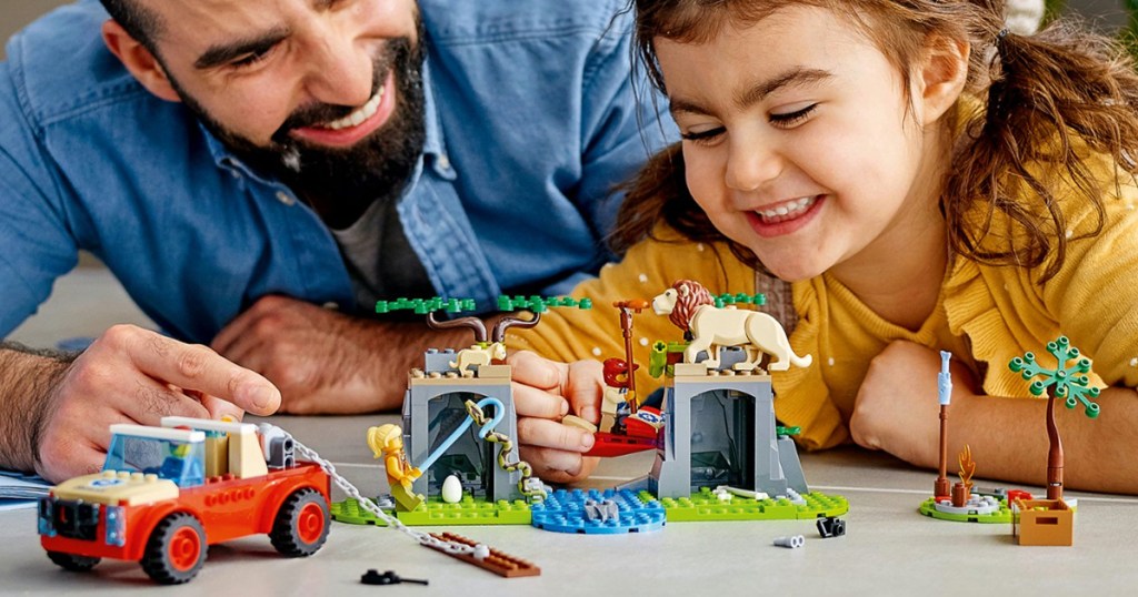 girl playing with lego wildlife set