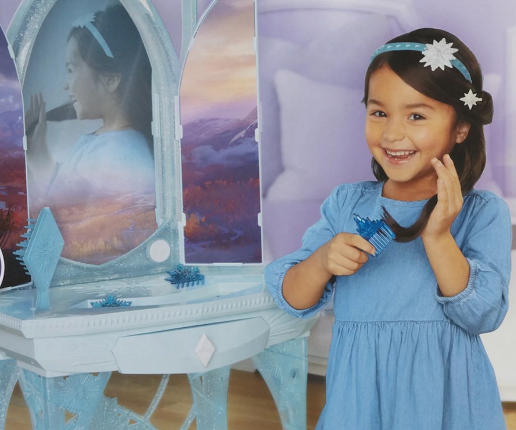 Little girl in front of vanity