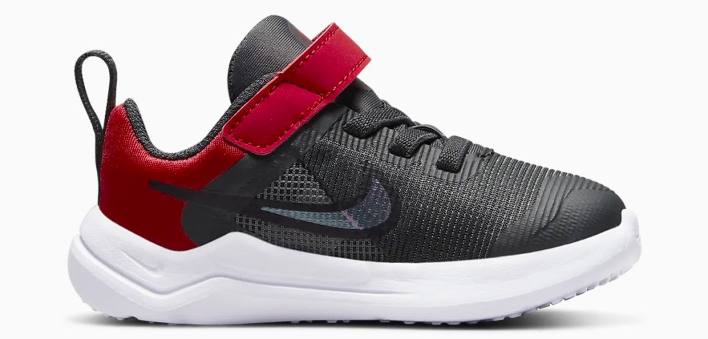 grey and red nike shoe