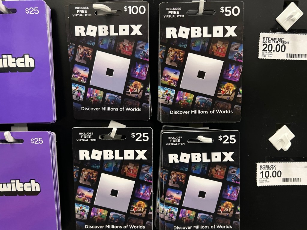 various Roblox Gift Cards hanging on a Target store display