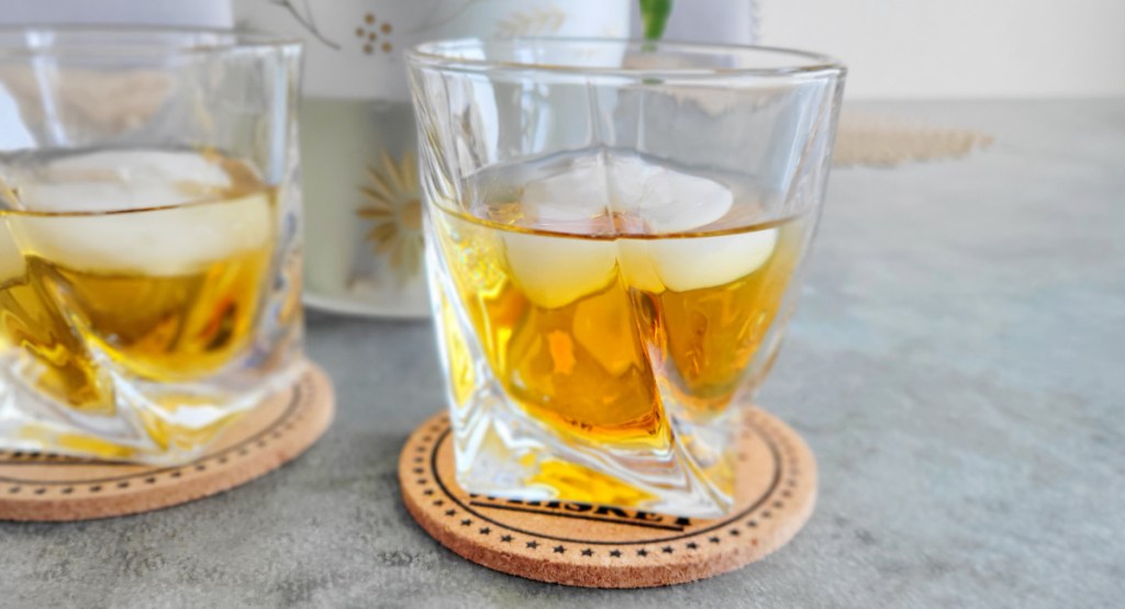 whiskey glasses on coasters