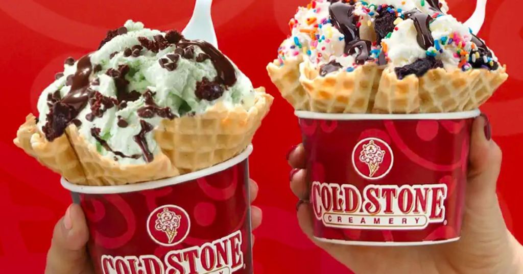 two ice creams from cold stone creamery in waffle cone bowls with chocolate syrup and sprinkles
