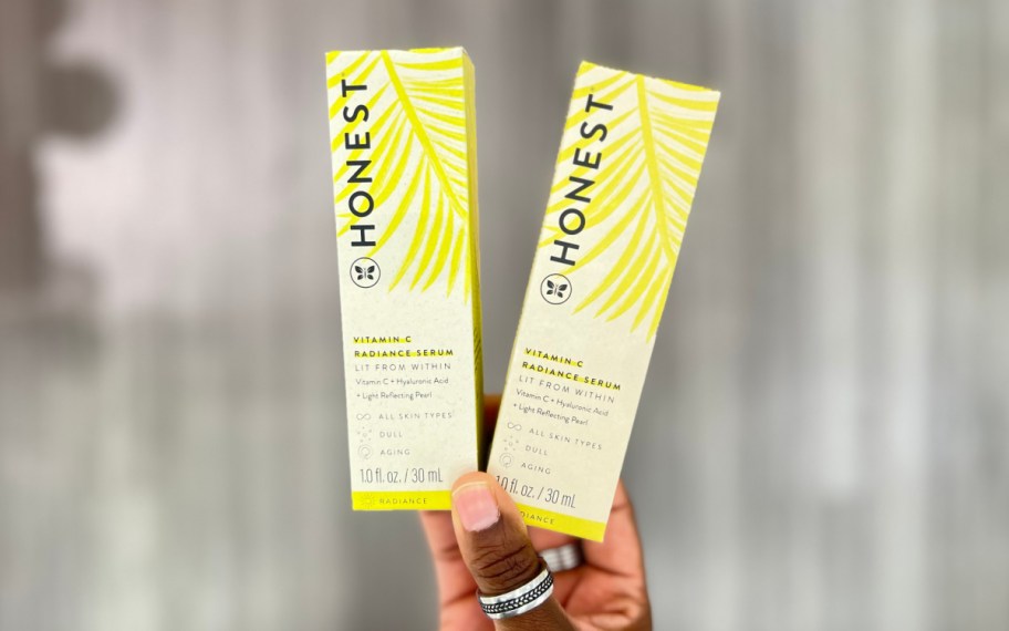 honest beauty vitamin c serum being held up