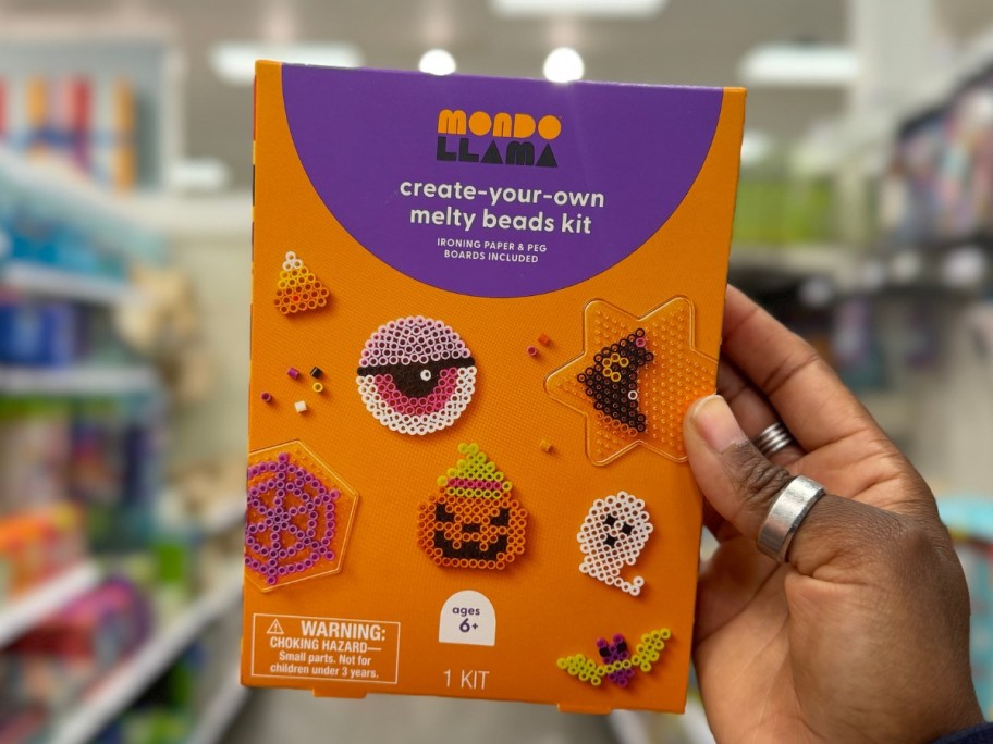 hand holding a Halloween melty beads activity kit