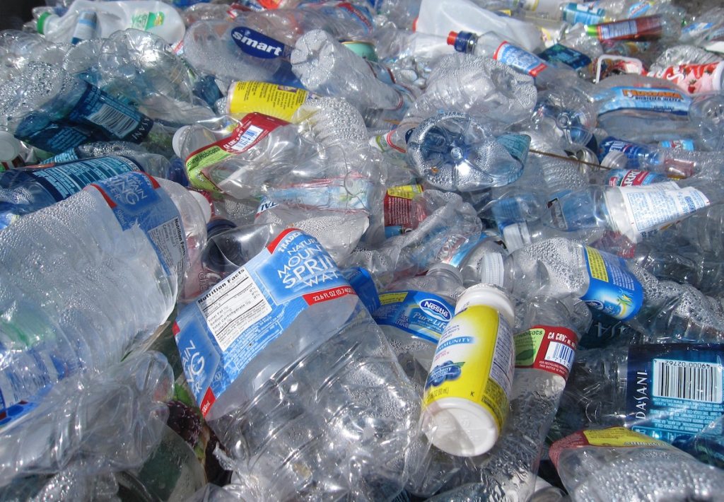 pile of used plastic bottles and how to recycle