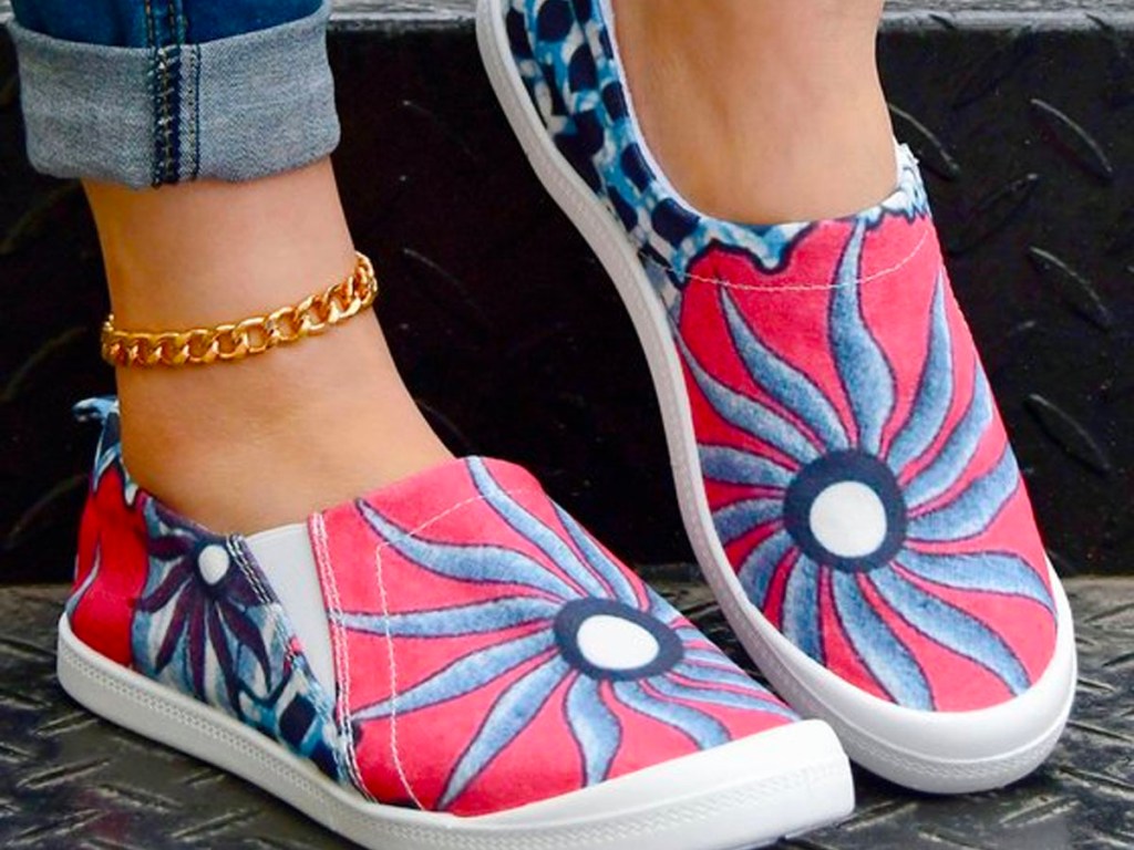 close up of woman wearing floral boat shoes