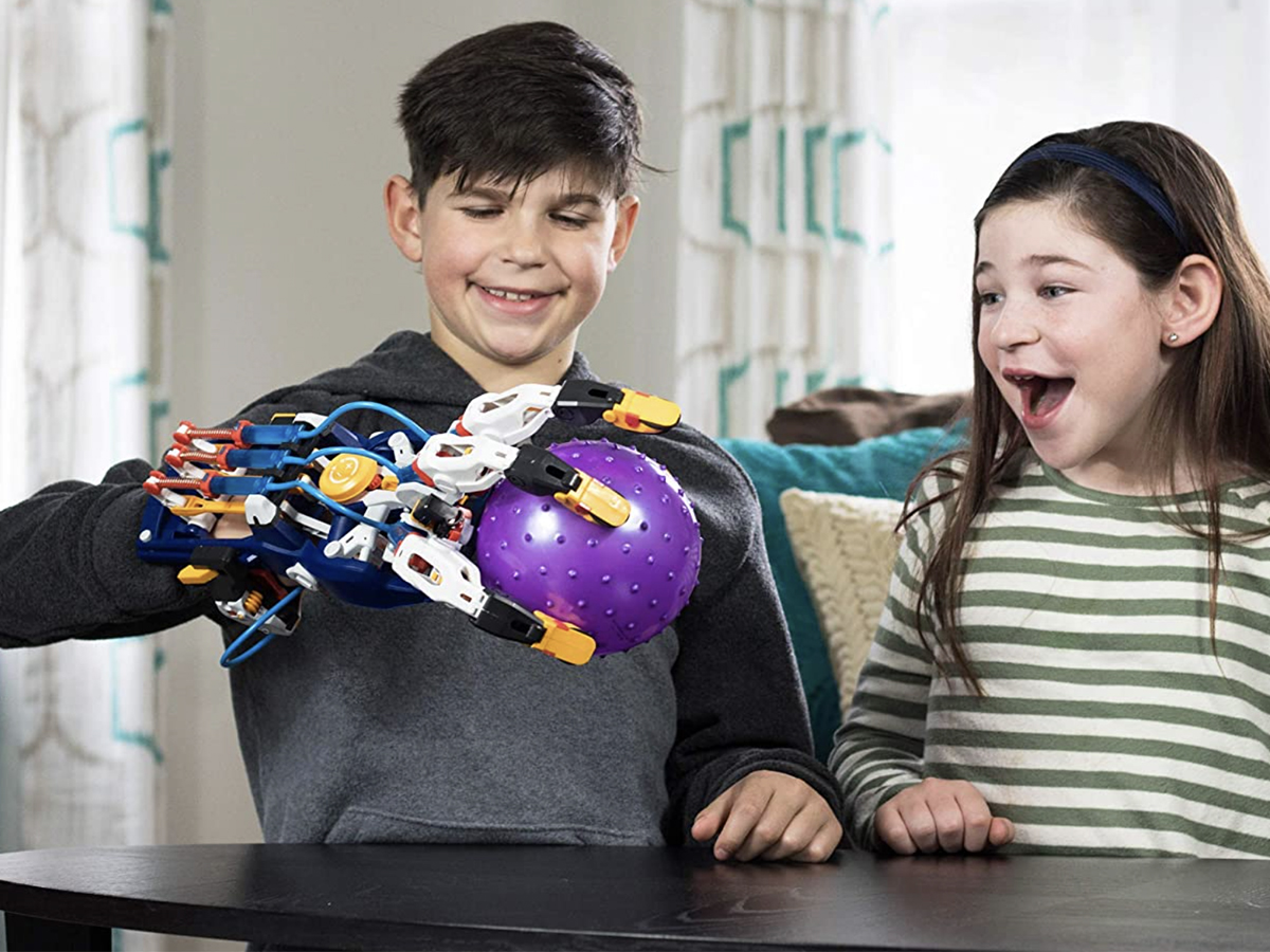 kids playing with mega cyborg hand