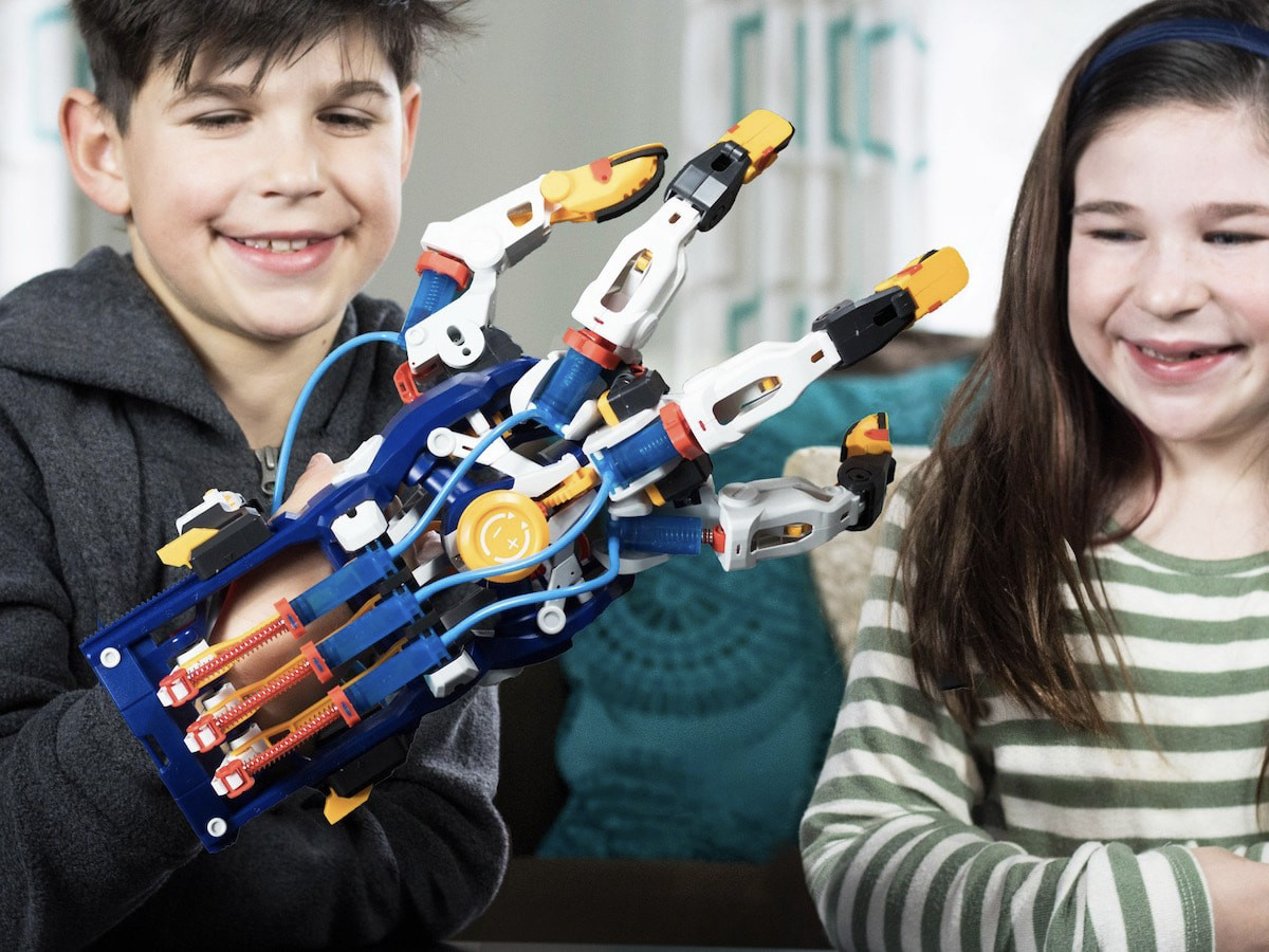 kids playing with mega cyborg hand