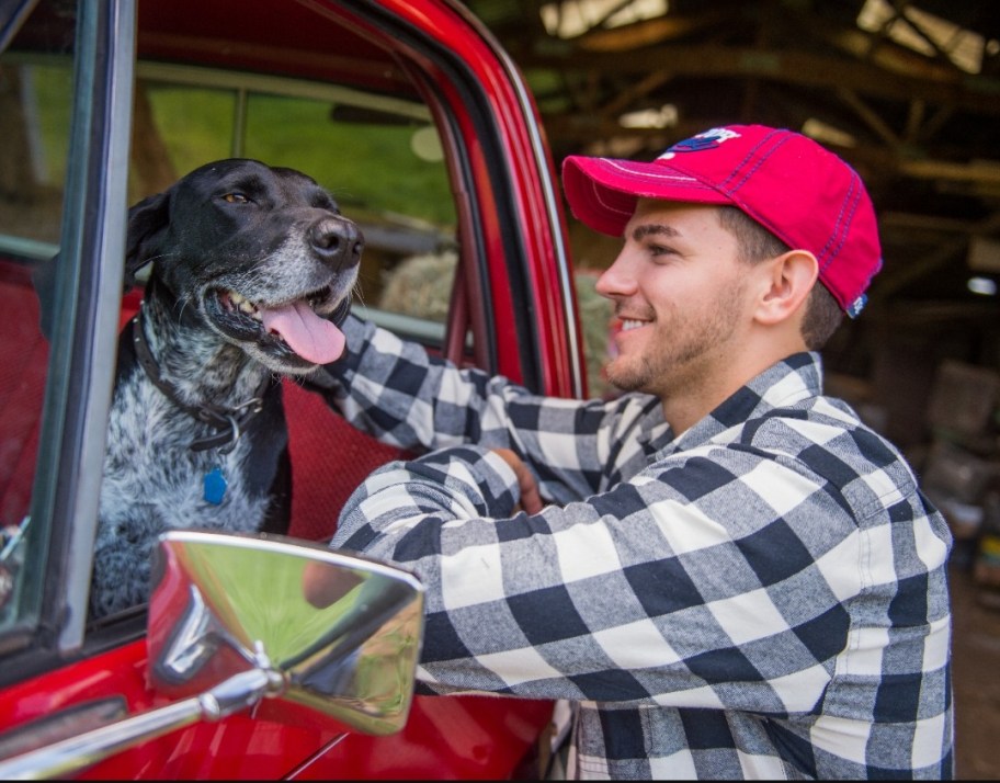 man petting a dog