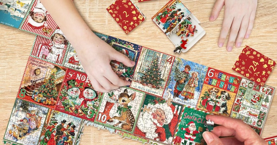 hands completing christmas countdown puzzle on table