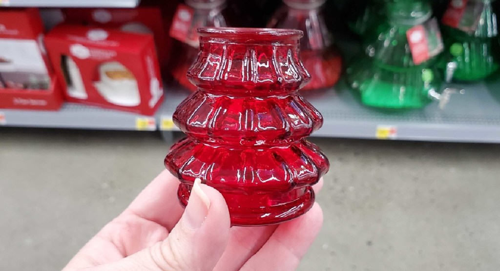 hand holding Christmas Shot Glass