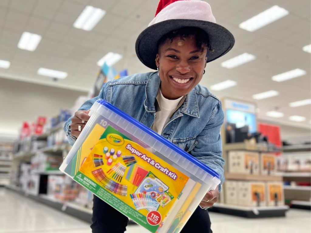 woman holding a 115-piece Crayola Arts & Crafts set