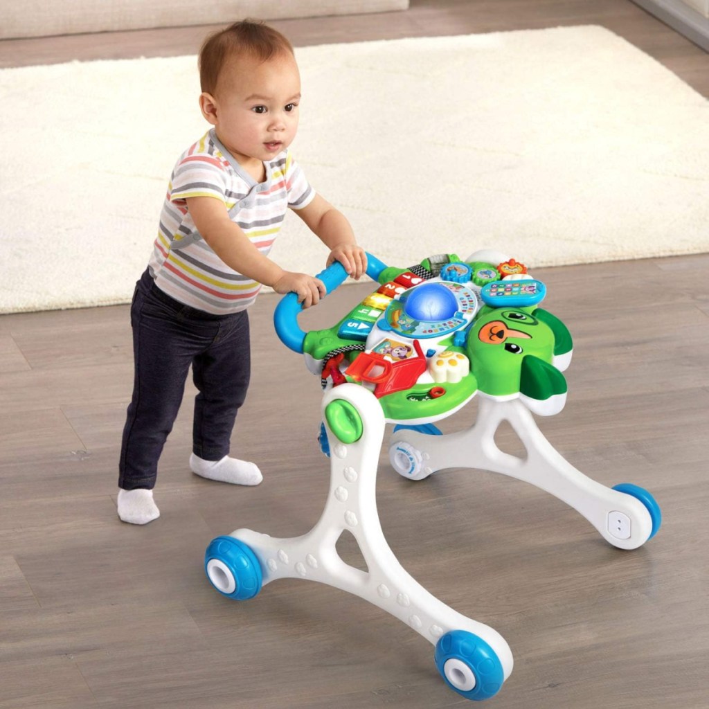 A toddler using the Leapfrog Scout's 3 in 1 Get Up And Go Walker