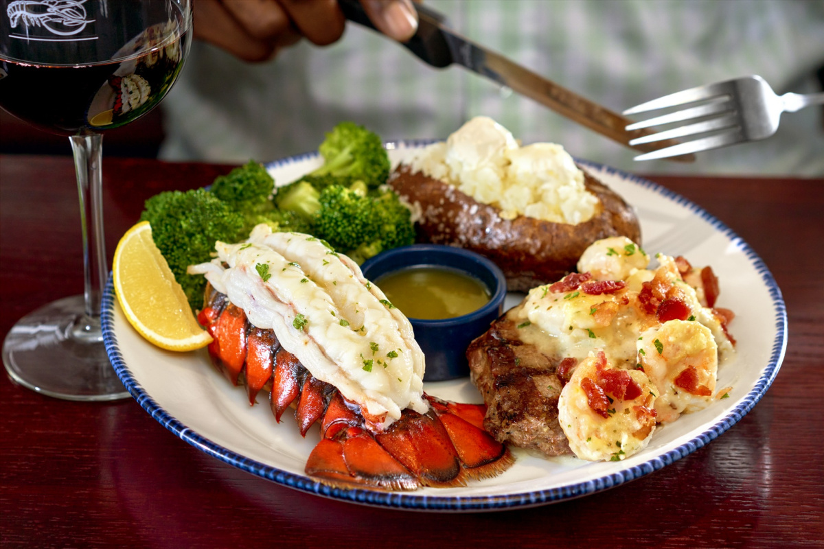 A Lobsterfest meal at Red Lobster containing a lobster tail and a sirloin steak topped with shrimp