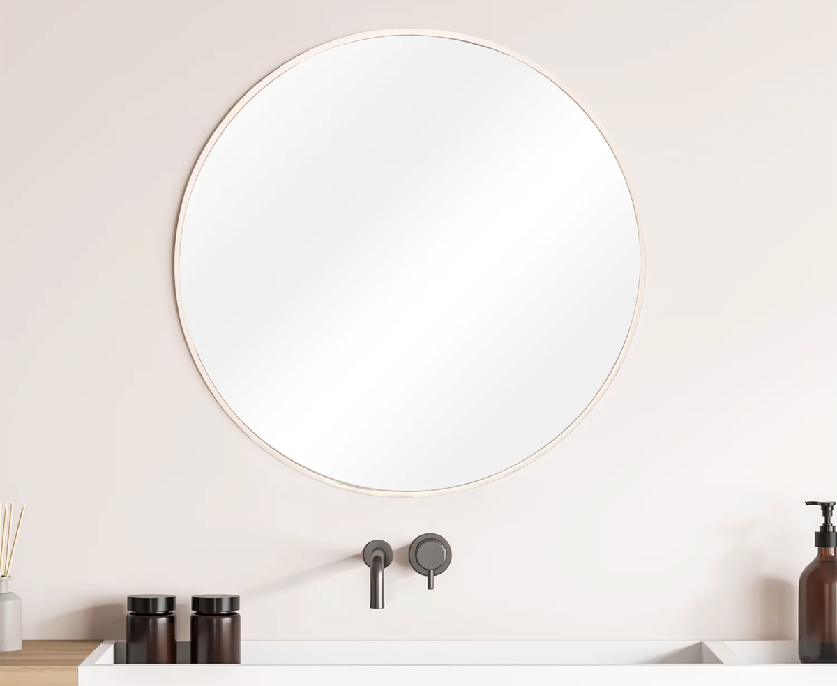 round mirror on bathroom wall