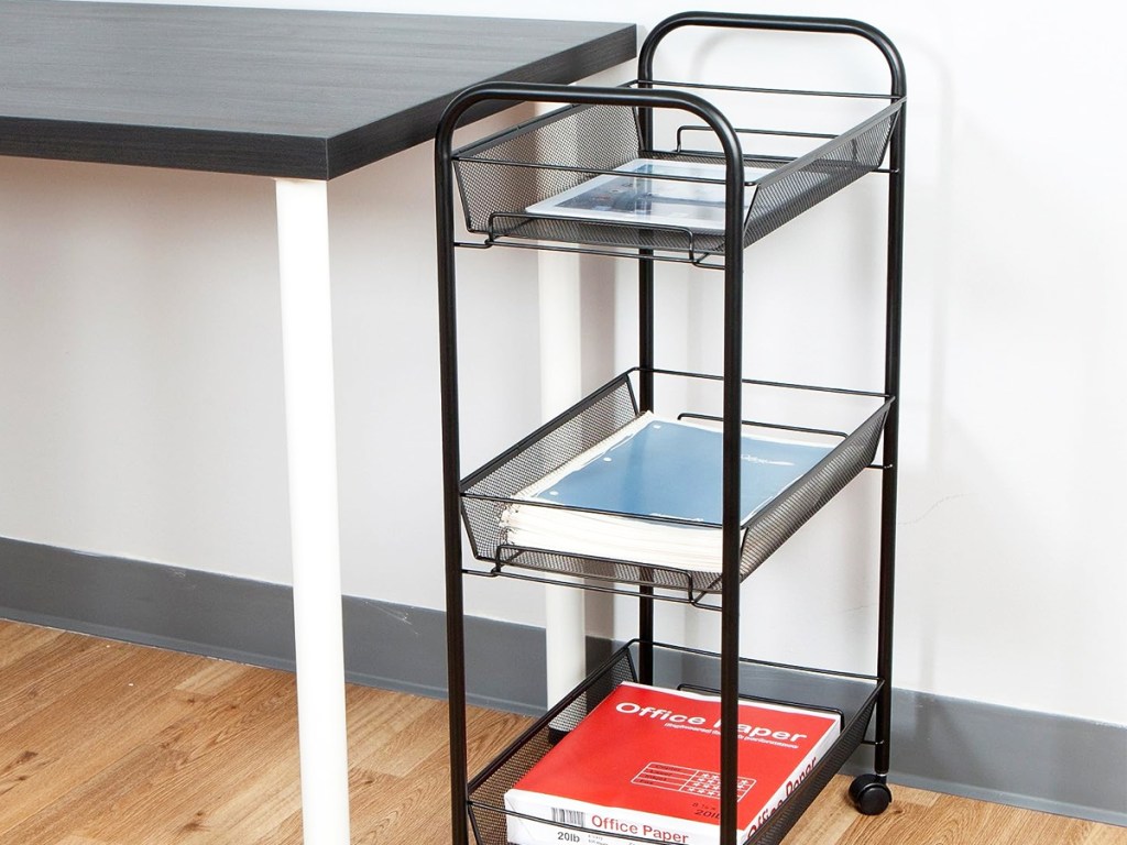 black 3 tier storage cart next to desk