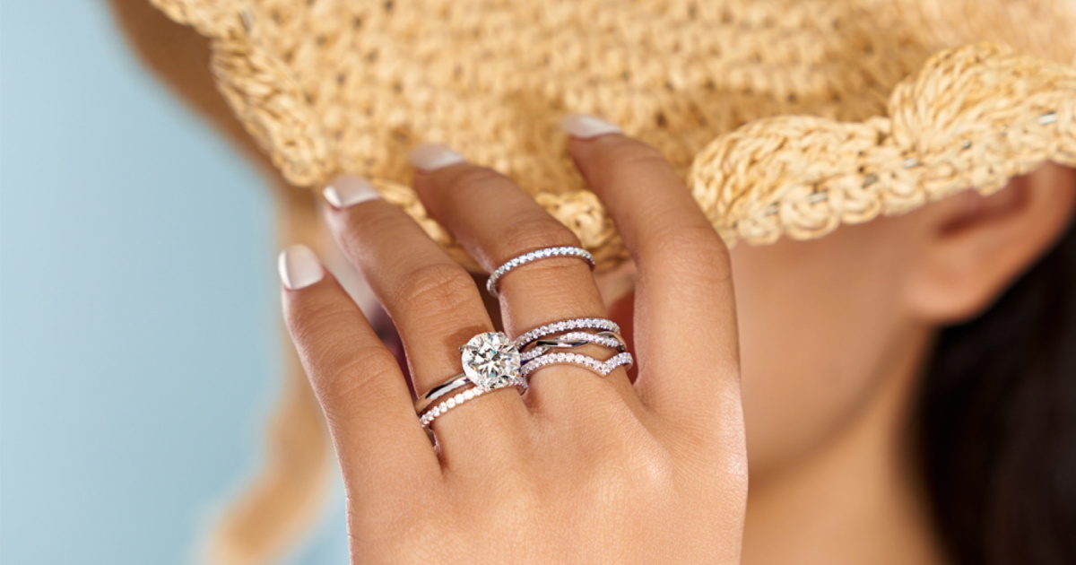 woman wearing rings and a straw hat