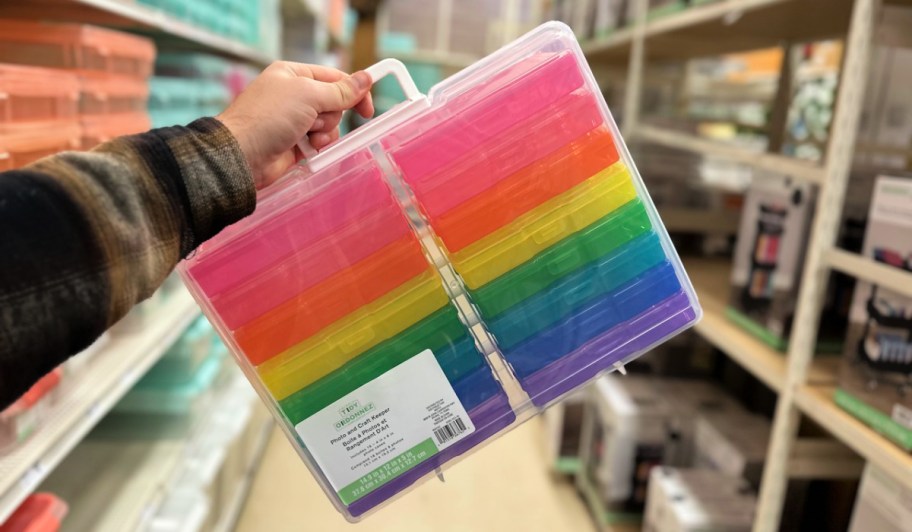 man holding a Simply Tidy Photo and Craft Keeper