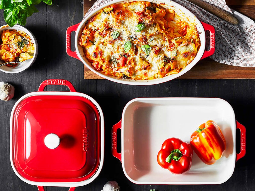 red and white staub bakeware set on table