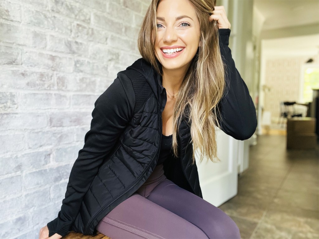 woman wearing black quilted jacket