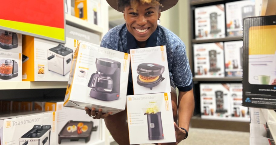 woman holding toastmaster appliances