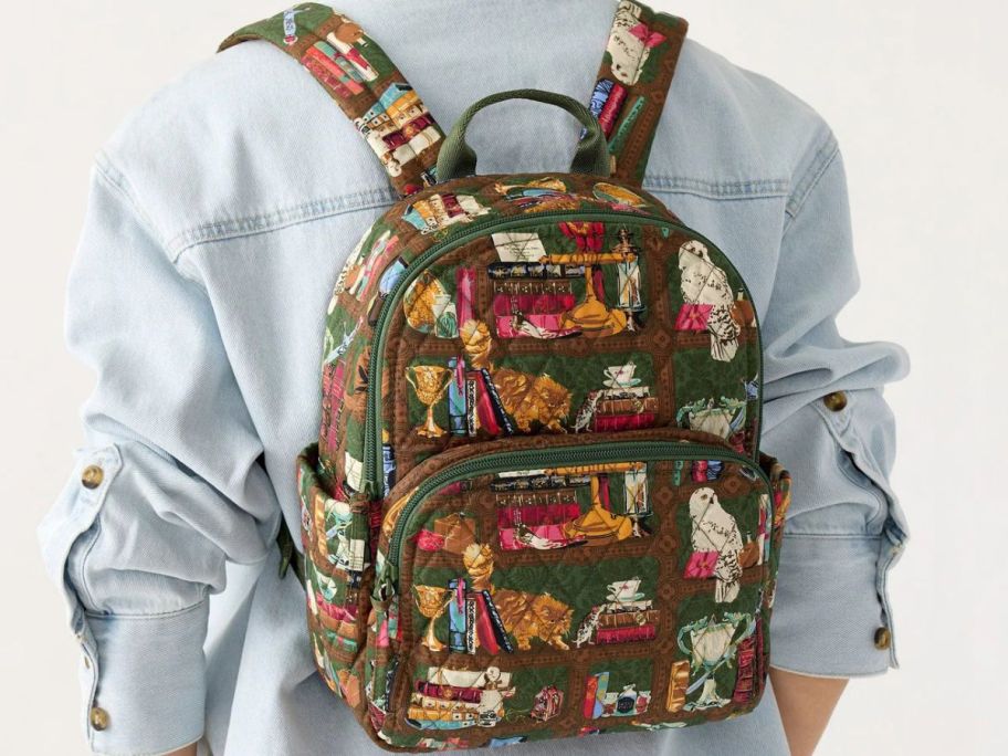 Woman's back wearing a Vera Bradley Harry Potter Hogwarts Library Small Banbury Backpack