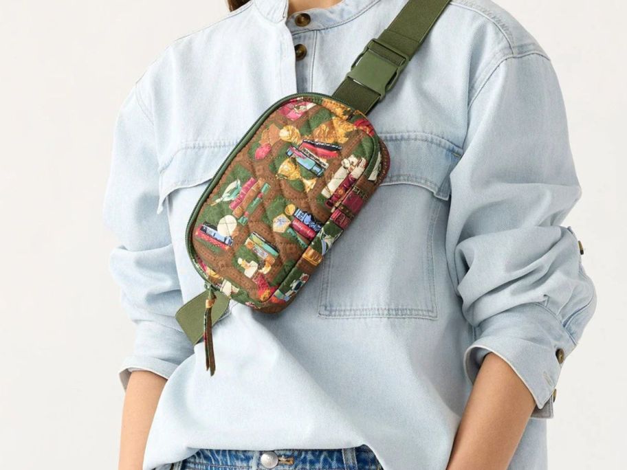 Woman wearing a Vera Bradley Harry Potter Hogwarts Library Woodward Small Belt Bag