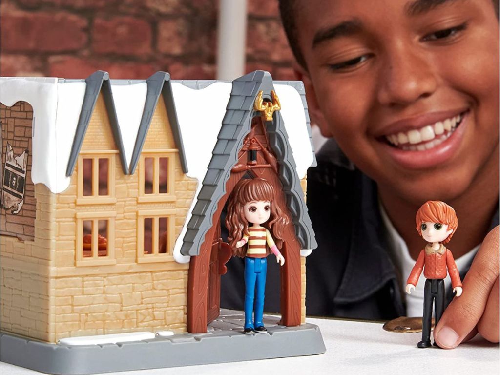 boy playing with harry potter mini playset