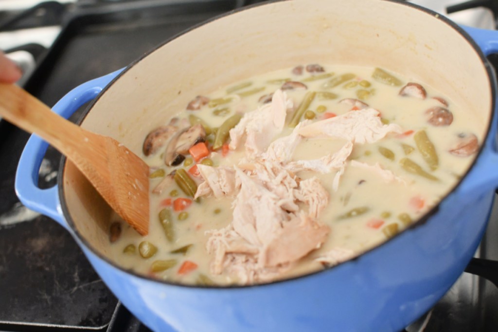 adding shredded chicken to soup