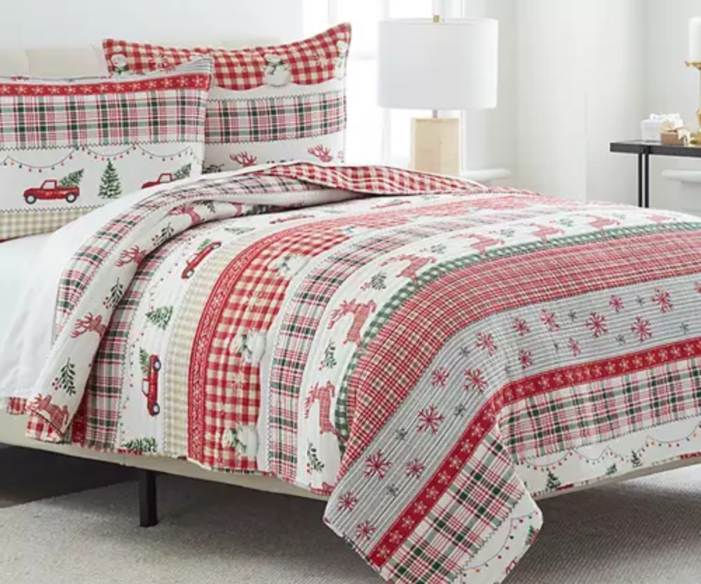 Christmas comforter on bed