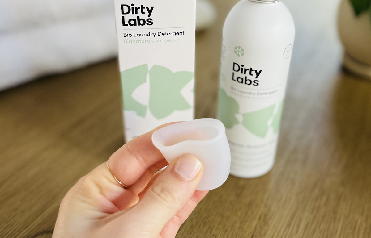 hand squeezing a small silicone cup