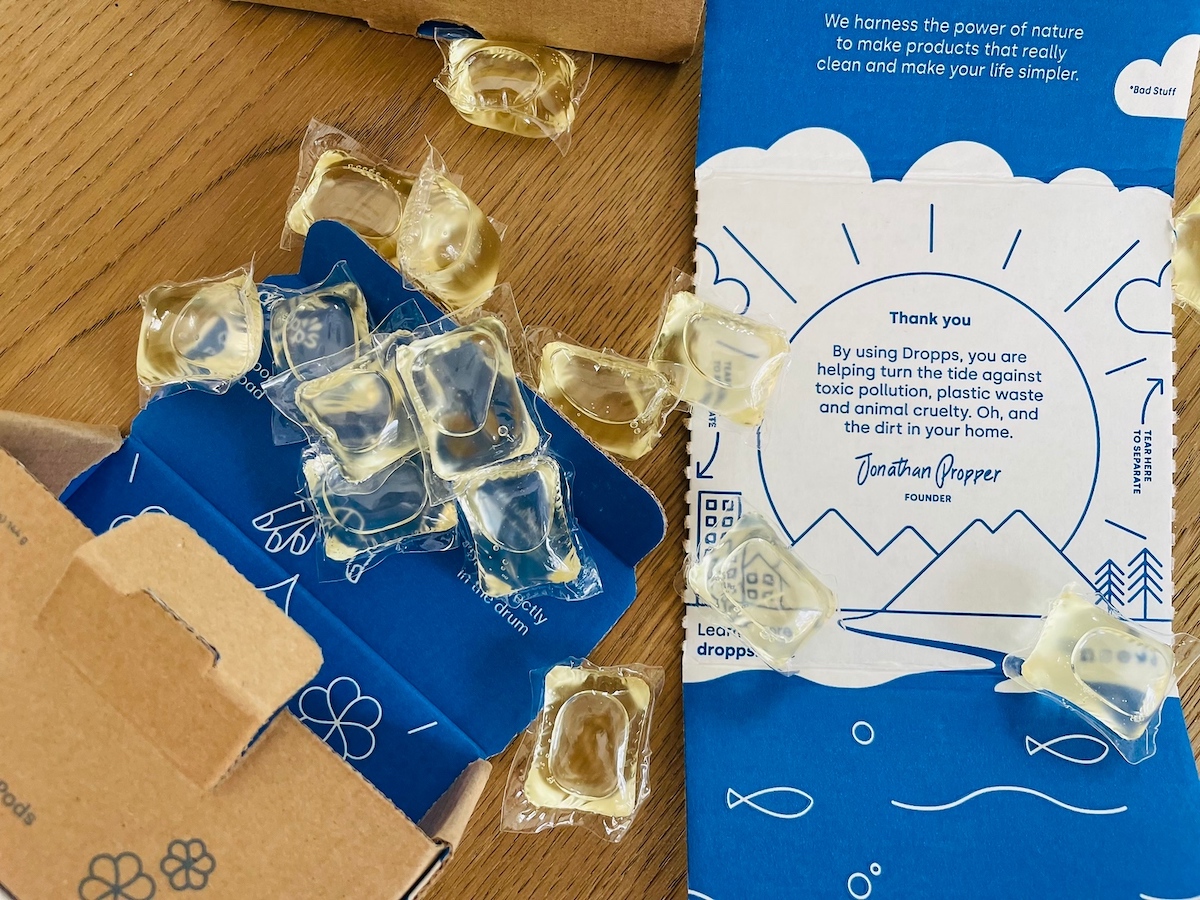 boxes of dropps pods spilled on wood table