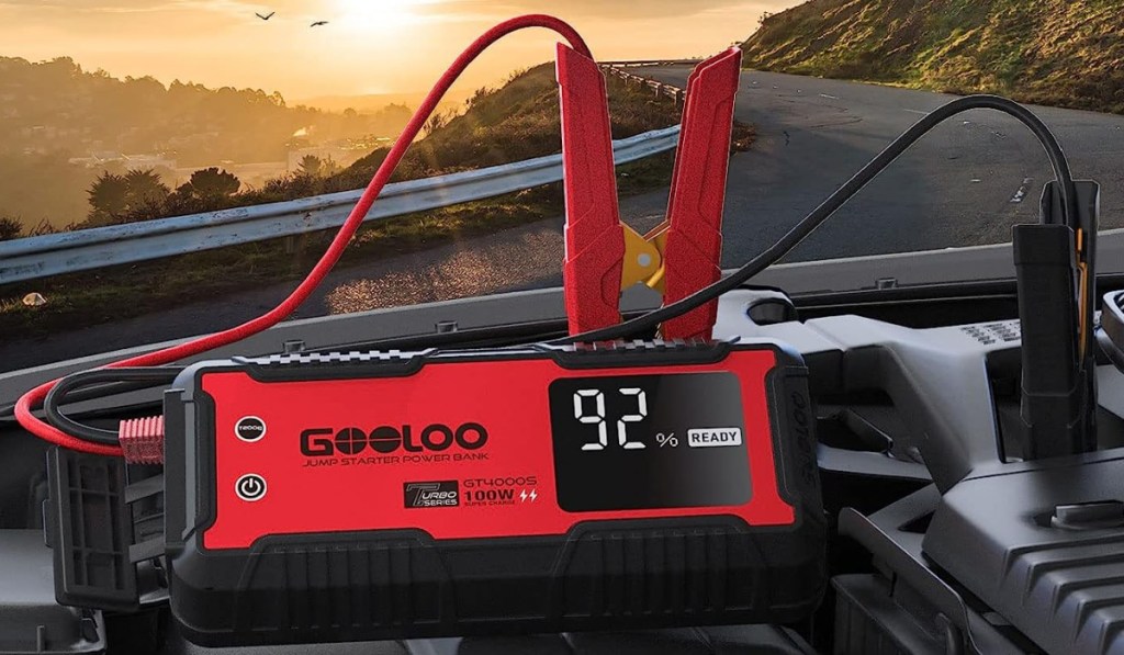 car jump starter attached in battery in sunset